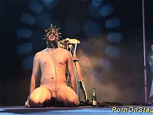 ultra-kinky fetish syringe demonstrate on stage